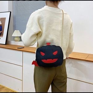 Black pumpkin cross body bag